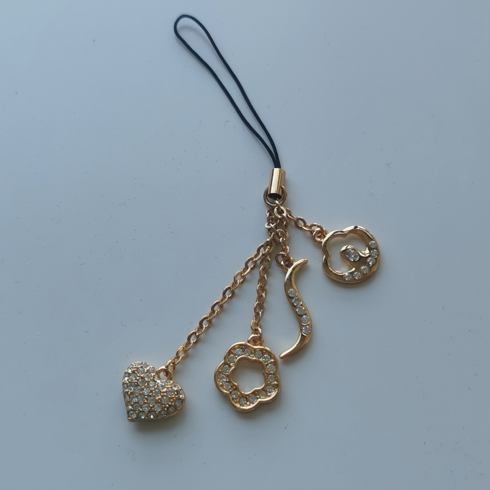 Shiseido gold accessory